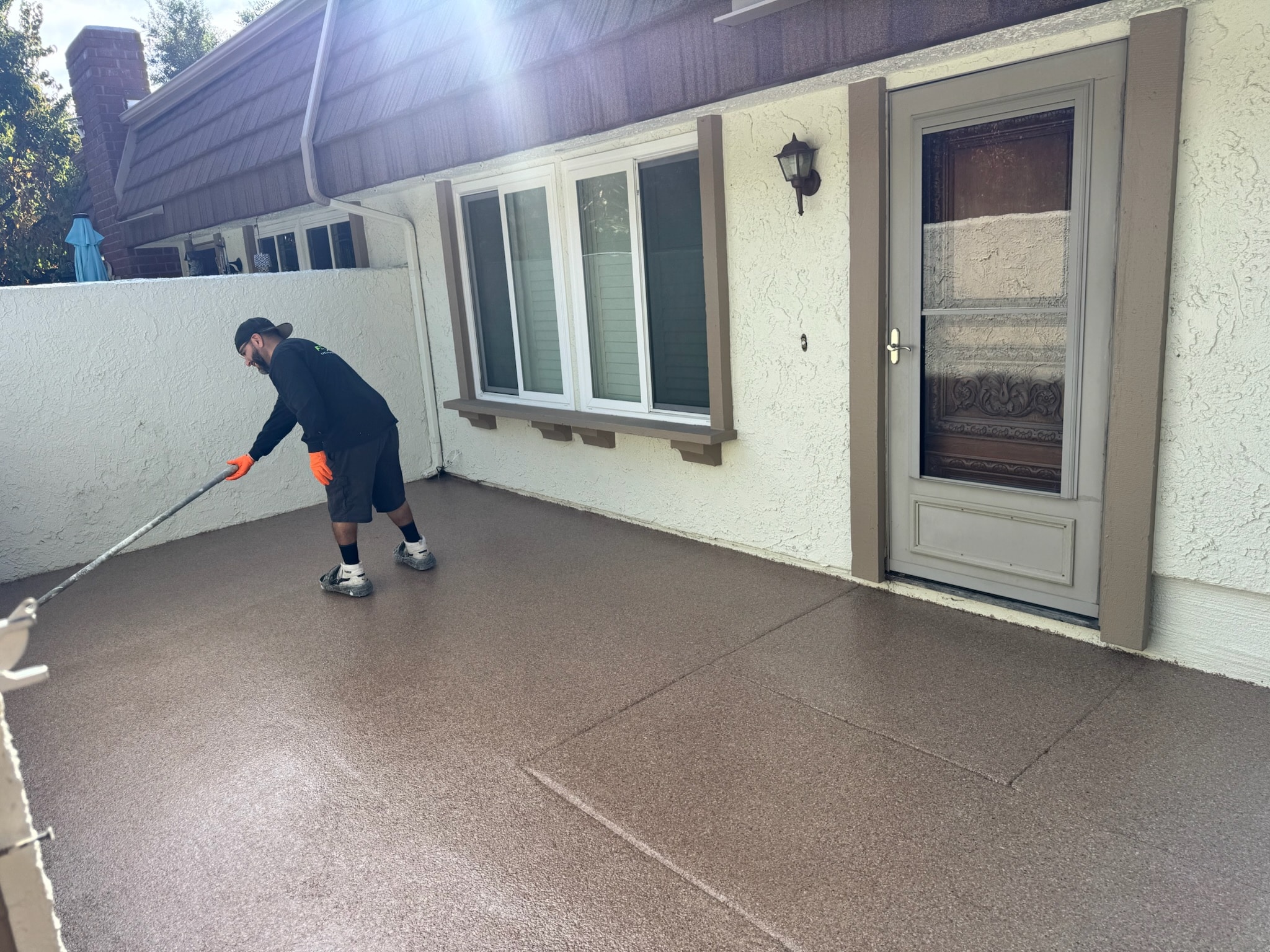 Five Star crew applying a balcony coating